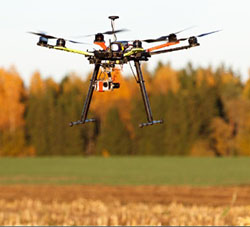 Drone hovering over a field